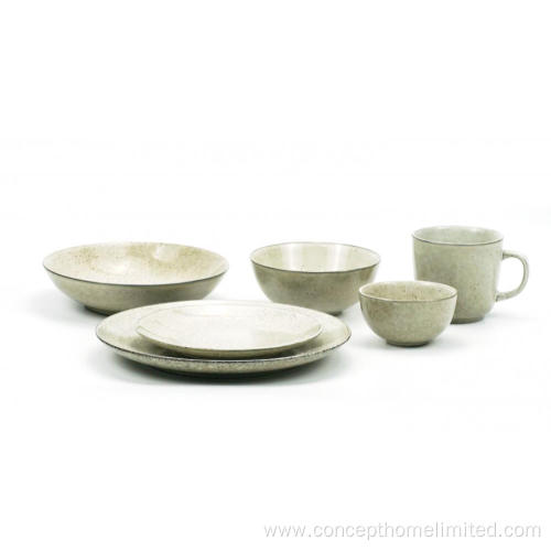 Reactive glazed stoneware dinner set in bluish gray